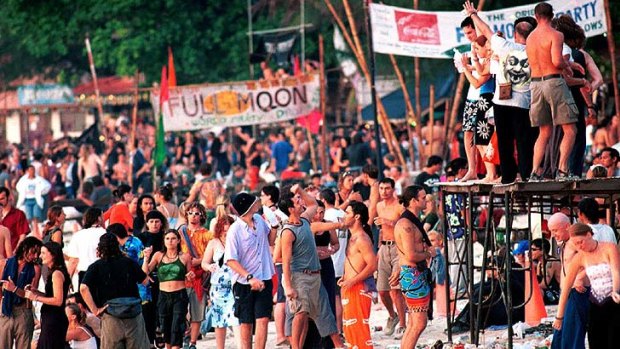 Wild time ... Full-moon party goers greet the dawn on the beach in Koh Phangan, Thailand in April 2000.