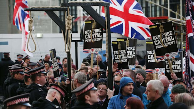 Protesters, many from far-right political organisations, demonstrate outside the court.