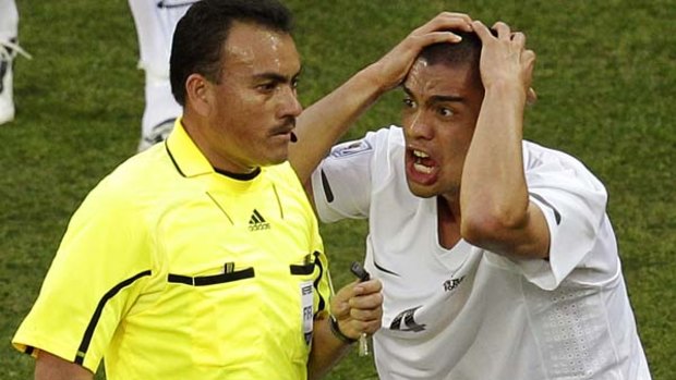 Despair ... New Zealand's Winston Reid, right, reacts after referee Carlos Batres awarded a penalty.