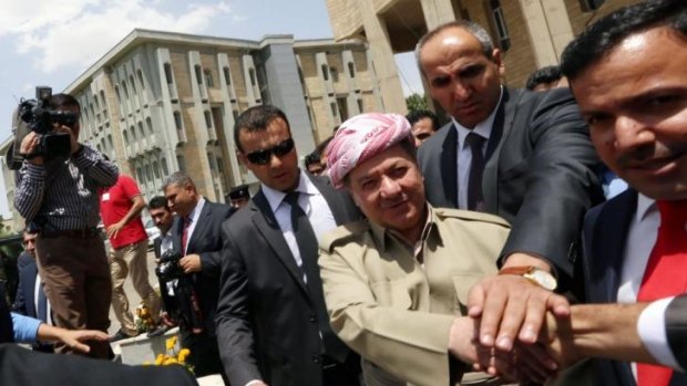 Seeking independence vote ... The president of Iraq's autonomous Kurdistan region, Massud Barzani (centre) arrives for a session of the Kurdistan parliament in Arbil.