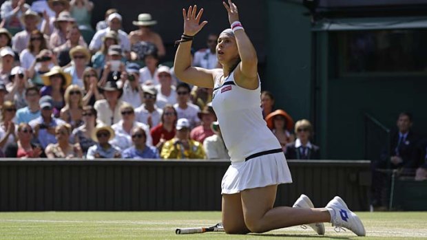 Marion Bartoli reacts after she won the women's singles final against Sabine Lisicki.