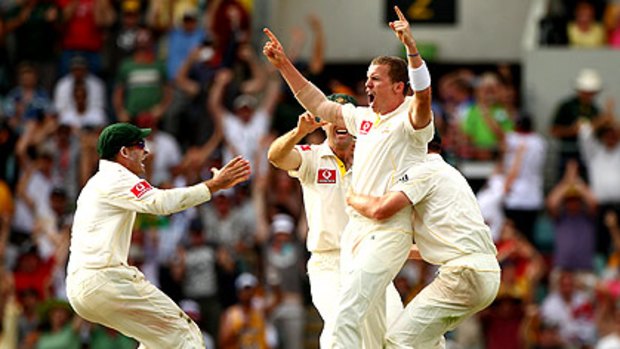 Peter Siddle celebrates after claiming a hat-trick by dismissing Stuart Broad yesterday at The Gabba.