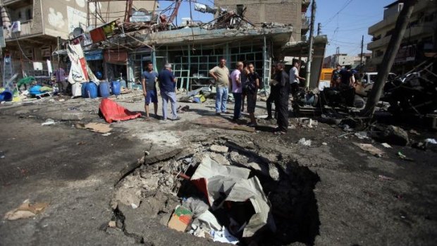 Where bombing is a fact of life: the crater from a car bomb east of Baghdad. 