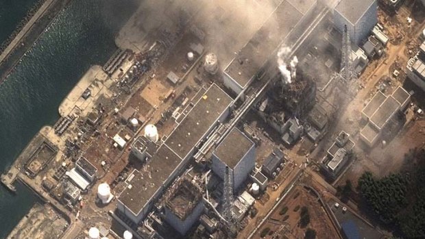 Blowing off ... fire erupts from the stricken nuclear plant at Fukushima, 250 kilometres north of Toyko.