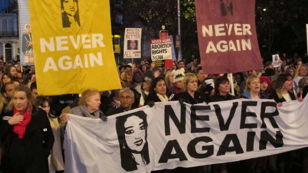Abortion rights protesters held pictures of Savita Halappanavar as they marched through central Dublin last year, demanding  Ireland's government ensures abortions can be performed to save a woman's life.