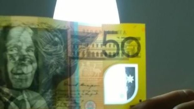 The counterfeit $50 note is thicker than an average bill.