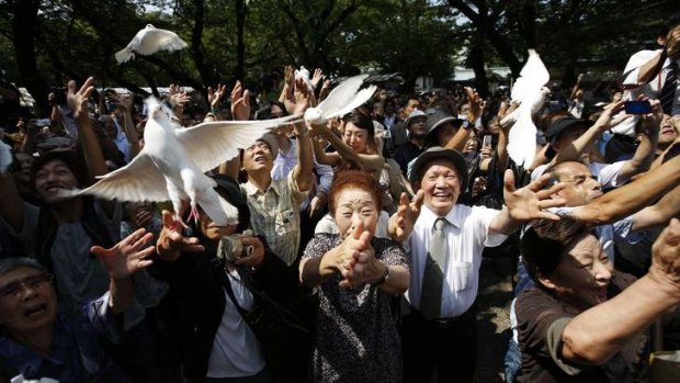 Call for peace: Doves are released at the Yasukuni Shrine that honours Japan's war dead.
