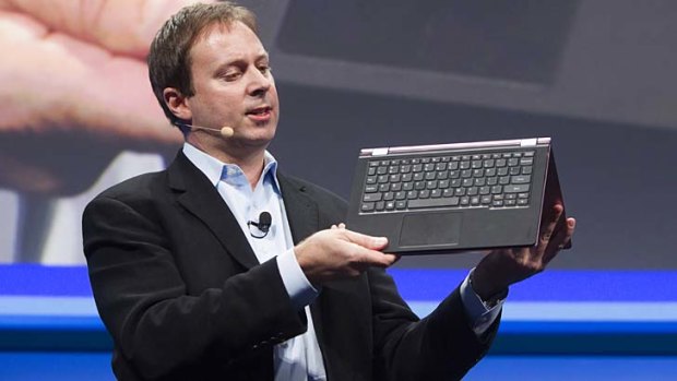 Intel's vice president of PC client group Kirk Skaugen shows off the Lenovo Yoga.