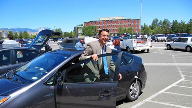 Nevada Governor Brian Sandoval takes a spin in a driverless car in Carson City, Nevarda, in late July.