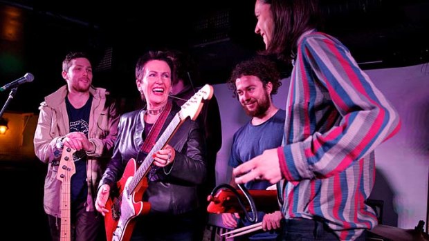 "Reviving Sydney's live music scene is a challenge that will require long-term investment from all levels of government": Clover Moore, centre, with the band High-Tails.