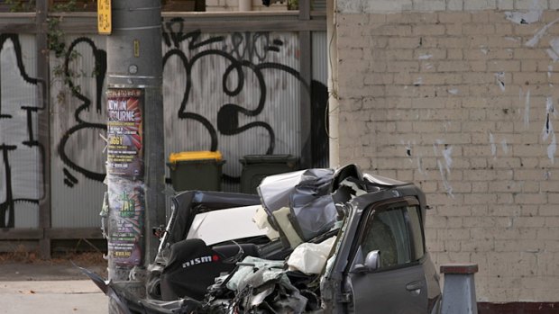 Crushed ... What remains of the car which crashed through a random breath testing station on Hoddle Street.