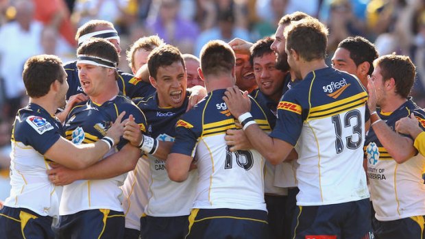 Christian Lealiifano of the Brumbies celebrates with team mates after kicking the winning penalty goal during the round three Super Rugby match between the Brumbies and the Cheetahs at Canberra Stadium on March 10, 2012 in Canberra, Australia.  (Photo by Cameron Spencer/Getty Images)