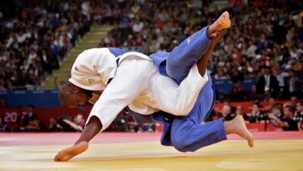 In competition ... Teddy Riner of France versus Faicel Jaballah of Tunisia in the 100kg plus heavyweight division of the judo.