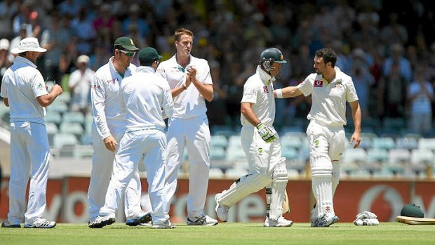 Ricky Ponting is greeted at the wicket by teammate Ed Cowan and a guard of honour by the South African players.