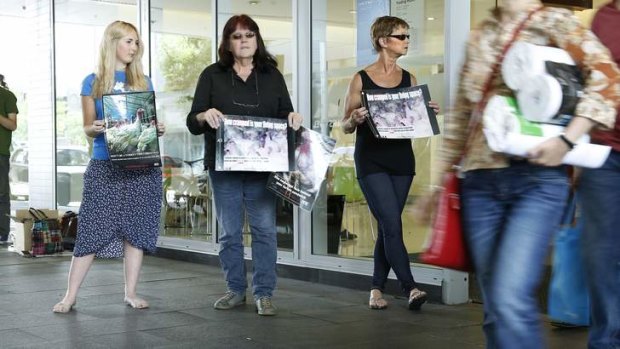 From left, Animal Liberation ACT members Jessica Hare, Carolyn Drew and Benice Richmond appeal to shoppers at the Canberra Centre.