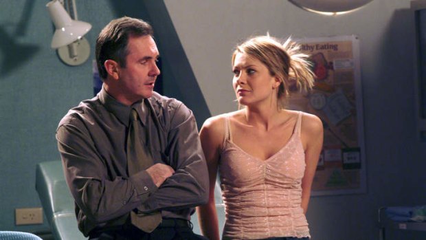 Surprise stories: Dr Karl Kennedy (Alan Fletcher) confesses to Izzy (Natalie Bassingthwaighte) in <i>Neighbours</i>.