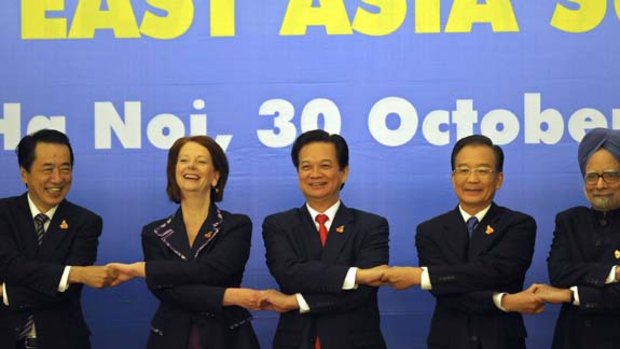 Shake on it... (from left) Japanese Prime Minister Naoto Kan, Prim Minister Julia Gillard, Vietnamese Prime Minister Nguyen Tan Dung, Chinese Premier Wen Jiabao and Indian Prime Minister Manmohan Singh at the 17th ASEAN summit in Hanoi.