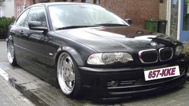 Police are searching for a black BMW belonging to a man charged over a drive-shooting.