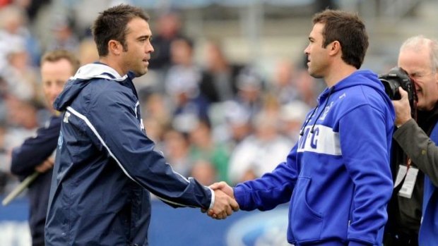 The twins shake before the game as opponents, Geelong v North Melbourne, May 2011.