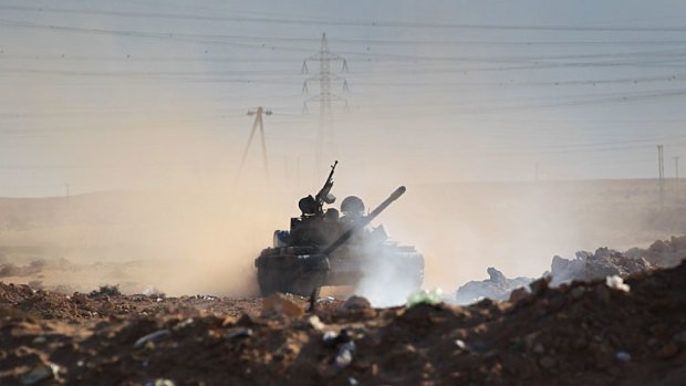 Civil war ... a rebel tank  near the oil town of Ras Lanuf.