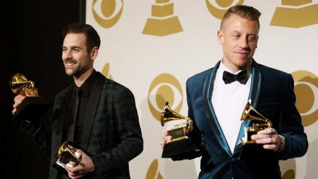 Macklemore (right) and Ryan Lewis pose backstage with their awards.