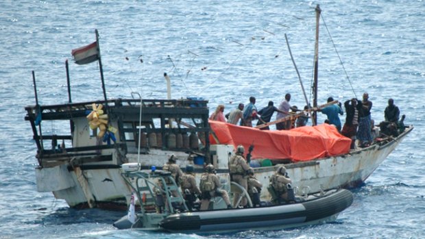 The boarding party from HMAS Stuart comes alongside the dhow that had been seized by Somali pirates, who held three Yemenis captive. :