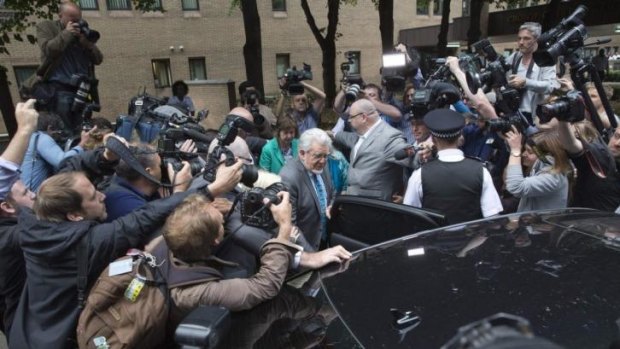 Centre of the storm: Rolf Harris leaves the court as a guilty man.