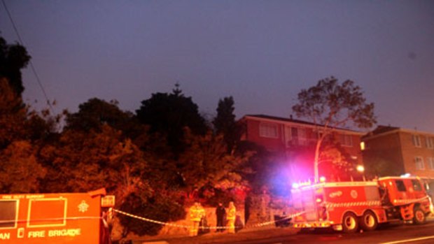 Firefighters outside Judy Moran's Moonee Ponds home this morning.