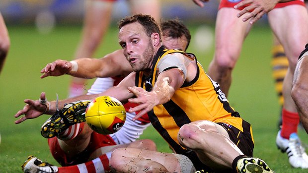 Hawthorn's Brad Sewell gathers a possession.