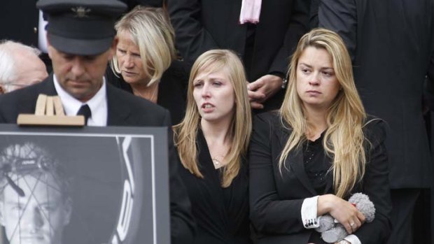 Grief ... Wouter Weylandt's widow, Anne Sophie, right, at the funeral of the Belgian cyclist in Ghent on Wednesday.