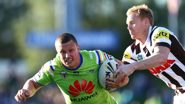 Jack Wighton of the Raiders is tackled by Peter Wallace of the Panthers.