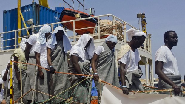 Migrants disembark from the SOS Mediterranee ship Aquarius at the Italian island of Lampedusa earlier this month.