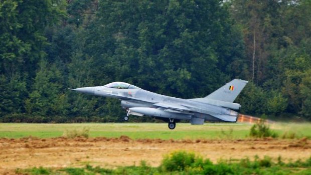 ATTACK FORCE: An F-16 fighter jet takes off from a military base in Europe.