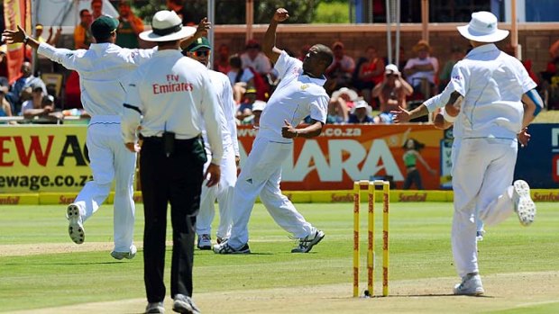 Vernon Philander celebrates after taking his fifth wicket in New Zealand's first innings.