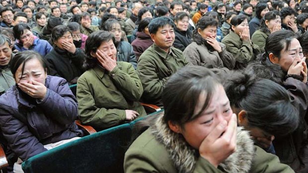 End of an era ...  North Koreans cry in Pyongyang.