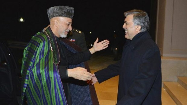 Turkish President Abdullah Gul, right, greets his Afghan counterpart President Hamid Karzai in Ankara, Turkey.
