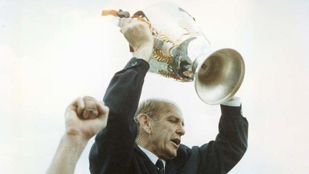 Winning ways: Allan Jeans holds aloft Hawthorn's 1989 premiership cup.