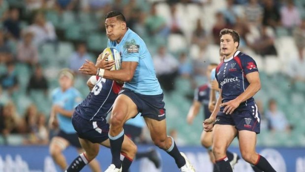Flyer: Israel Folau bamboozles the Rebels' defence.