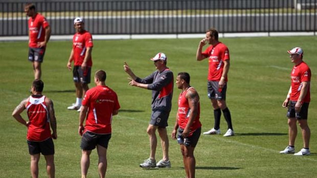 Marshalling his troops ... Dragons coach Wayne Bennett instructs his players during a training session at Redfern Oval yesterday in preparation for tonight's preliminary final.