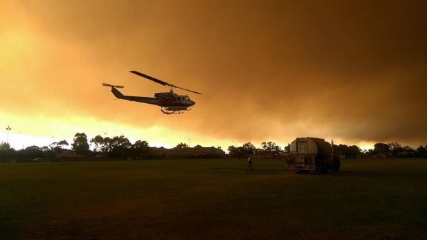 A chopper takes off in Harvey on Thursday afternoon.