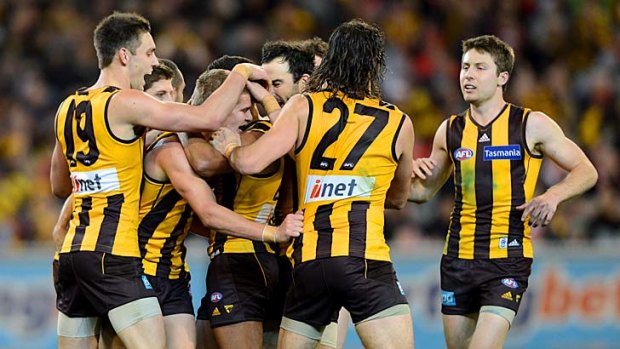 Hawthorn's Jed Anderson celebrates a goal with his teammates during the qualifying final against Sydney.
