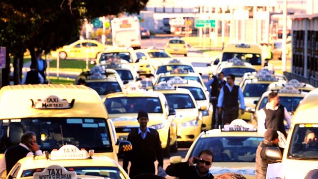 Taxi drivers blockading the entrance to the pick up/drop off area at Melbourne Airport.