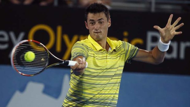 Bernard Tomic plays a forehand return to Juan Martin Del Potro of Argentina during the men's singles final at the Sydney International.