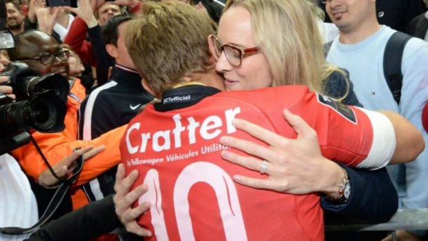 Wilkinson hugs his wife in the stands after winning the Top 14 title in France. The pair were married last November with only two people present.