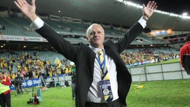 Graham Arnold after last year's A-League Grand Final triumph with the Mariners.