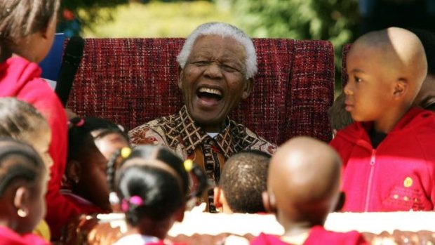 Nelson Mandela joking with youngsters as they celebrated his 89th birthday.