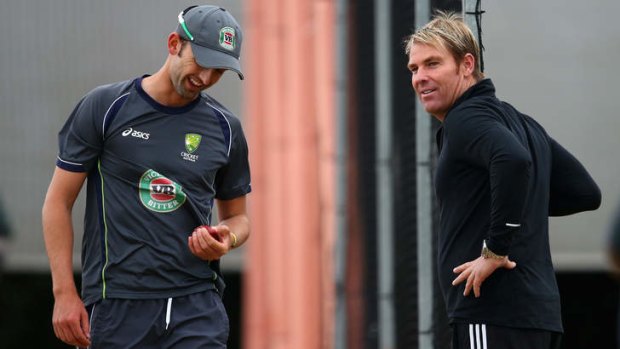 Come in, spinner: Shane Warne, right, gives advice to Nathan Lyon before the start of the third Ashes Test at Old Trafford.