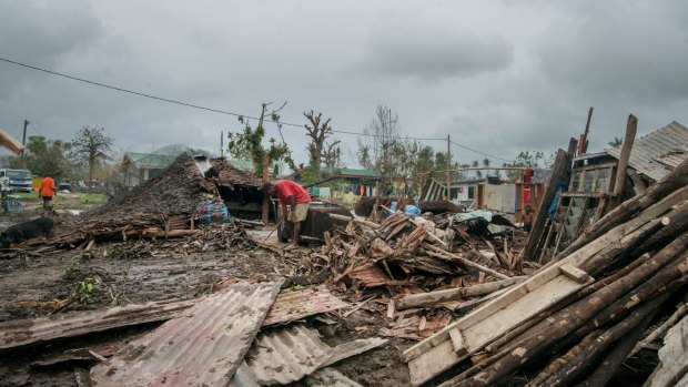 Westpac will not sell its Vanuatu business after Cyclone Pam in March, which left debris scattered across Port Vila.