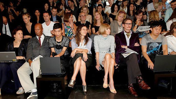 Bloggers sit in the front row of a catwalk show alongside Anna Wintour.