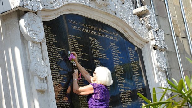 Trish Cearns places a floral tribute next to her daughter Jodie Cearns name on the Bali Memorial earlier this week.